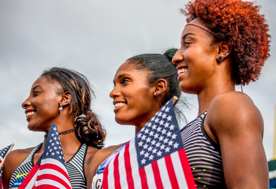Nike’s Nia Ali, Kristi Castlin, and Nike’s Brianna Rollins pose with their American flags as they celebrate their qualifying for Rio in the women’s 200 meter dash. Day Eight of the U.S. Olympic Trials Track and Field continued on Friday at Hayward Field in Eugene, Ore. and will continue through July 10. Photo by Katie Pietzold