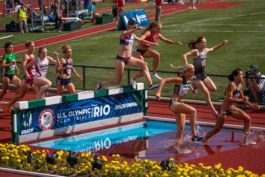 Runners jump over the water during the women’s 3,000 meter steeplechase. Day Four of the U.S. Olympic Trials Track and Field were held Monday at Hayward Field in Eugene, Ore. and will continue through July 10. Photo by Katie Pietzold