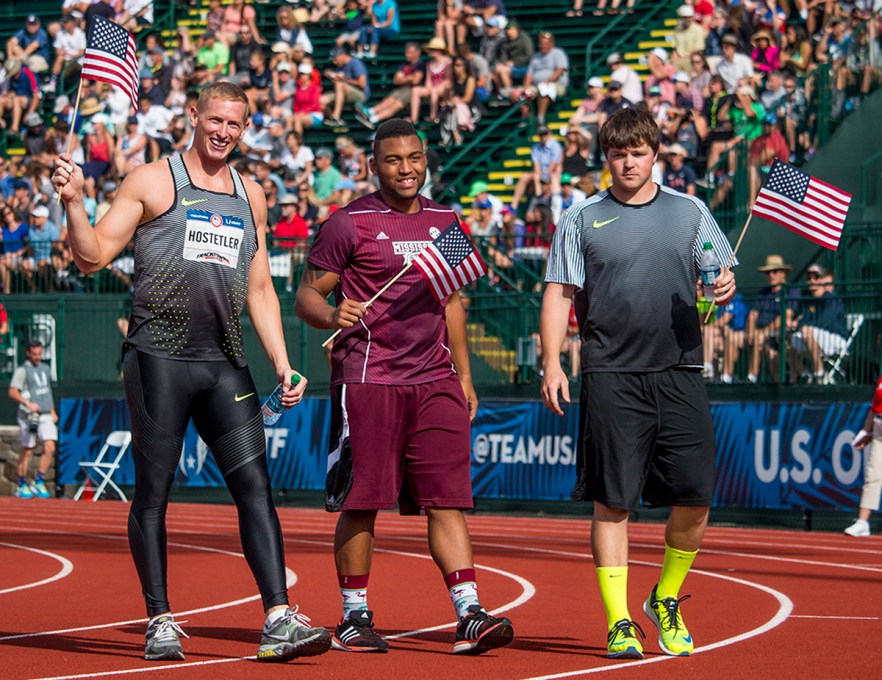 Cyrus Hostetler, Mississippi State’s Curtis Thompson, and Nike’s Riley Dolezal wave flags to the crowd after qualifying for Rio in the men’s javelin. Day Four of the U.S. Olympic Trials Track and Field were held Monday at Hayward Field in Eugene, Ore. and will continue through July 10. Photo by Katie Pietzold