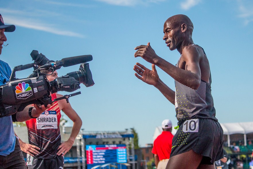Nike’s Bernard Lagat celebrates towards the television camera after placing first in the second heat of the men’s 5,000 meter run. Day Four of the U.S. Olympic Trials Track and Field were held Monday at Hayward Field in Eugene, Ore. and will continue through July 10. Photo by Katie Pietzold