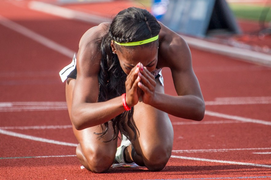 Nike’s Chrishuna Williams collapses to the ground and bows as she qualifys for Rio after taking third in the women’s 800 meter final. Day Four of the U.S. Olympic Trials Track and Field were held Monday at Hayward Field in Eugene, Ore. and will continue through July 10. Photo by Katie Pietzold