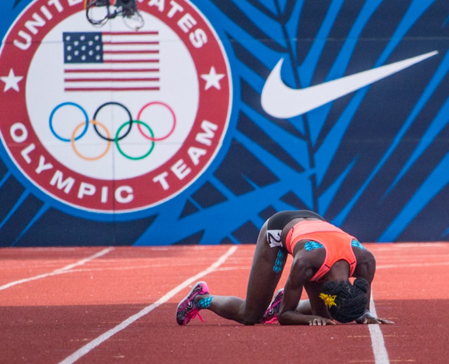 Asics’ runner and former Olympian Alysia Montano collapses as she attempts to make it to the finish line of Hayward Field. Just before the final stretch, Montano collided with another runner and fell. Montano was unable to get up and complete the race. Day Four of the U.S. Olympic Trials Track and Field were held Monday at Hayward Field in Eugene, Ore. and will continue through July 10. Photo by Katie Pietzold