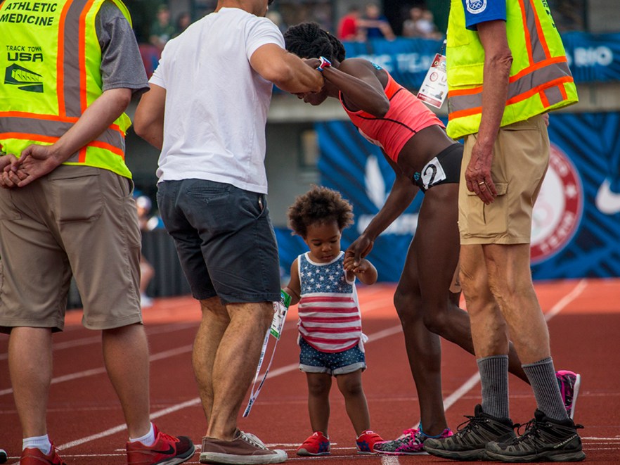 Asics’ runner and former Olympian Alysia Montano receives support from her husband and child as she leaves Hayward Field unable to complete the women’s 800 meter final after colliding with another runner. Day Four of the U.S. Olympic Trials Track and Field were held Monday at Hayward Field in Eugene, Ore. and will continue through July 10. Photo by Katie Pietzold