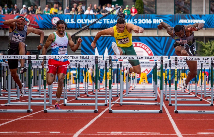 Nike's Aries Merritt, Ronald Brookins, Oregon Duck Devon Allen, and Nike's David Oliver race to the finish of the men's 110 meter hurdle semis. Allen placed first in 13.40. Day Nine of the U.S. Olympic Trials Track and Field continued on Saturday at Hayward Field in Eugene, Ore. and will continue through July 10. Photo by Katie Pietzold