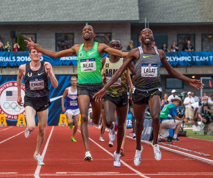 Nike OTC Hassan Mead and Nike's Bernard Lagat celebrate as they cross through the finish line of the men's 5,000 meter run finals. The two qualified for Rio after Lagat placed first in 13:35.50 and Mead in 13:35.70. Day Nine of the U.S. Olympic Trials Track and Field continued on Saturday at Hayward Field in Eugene, Ore. and will continue through July 10. Photo by Katie Pietzold