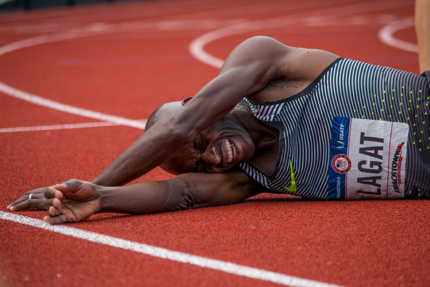 Nike's Bernard Lagat falls to the ground in celebration of qualifying for Rio after placing first in 13:35.50 of the men's 5,000 meter run finals. Day Nine of the U.S. Olympic Trials Track and Field continued on Saturday at Hayward Field in Eugene, Ore. and will continue through July 10. Photo by Katie Pietzold