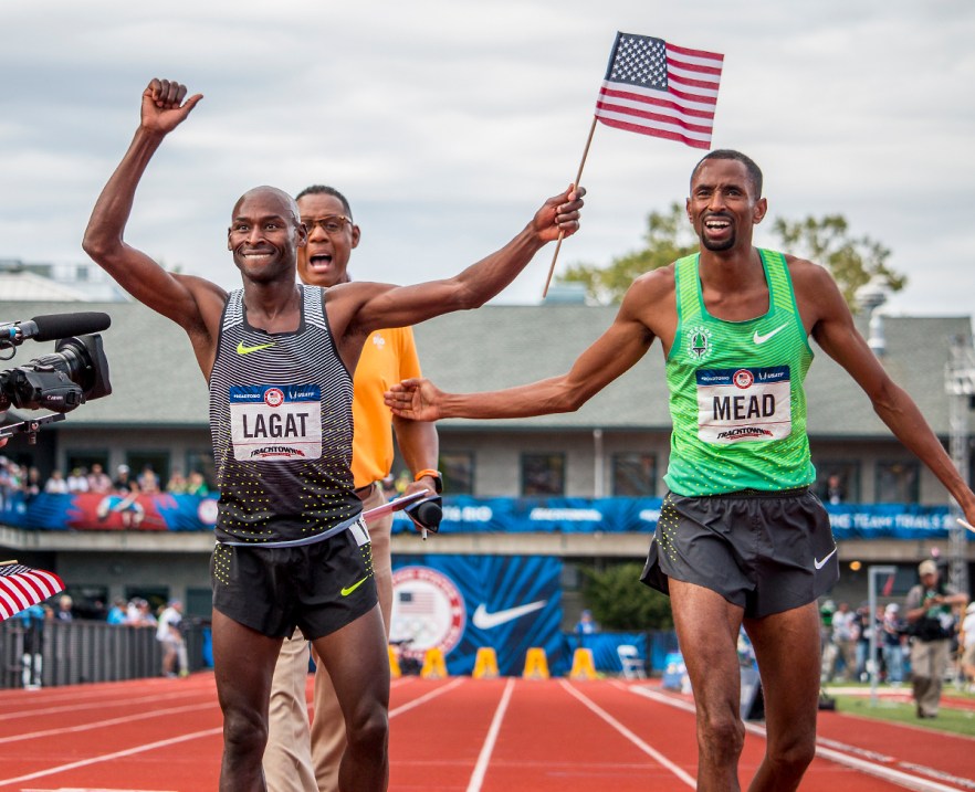 Nike's Bernard Lagat waves to the crowd with Nike OTC's Hassan Mean after the two qualified for Rio in the men's 5,000 meter run finals. Day Nine of the U.S. Olympic Trials Track and Field continued on Saturday at Hayward Field in Eugene, Ore. and will continue through July 10. Photo by Katie Pietzold