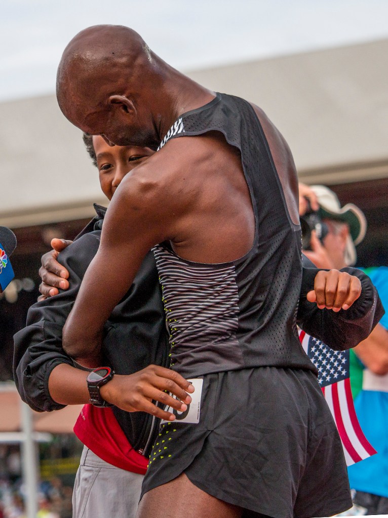 Nike's Bernard Lagat embraces his son after qualifying for Rio in the men's 5,000 meter run. Day Nine of the U.S. Olympic Trials Track and Field continued on Saturday at Hayward Field in Eugene, Ore. and will continue through July 10. Photo by Katie Pietzold
