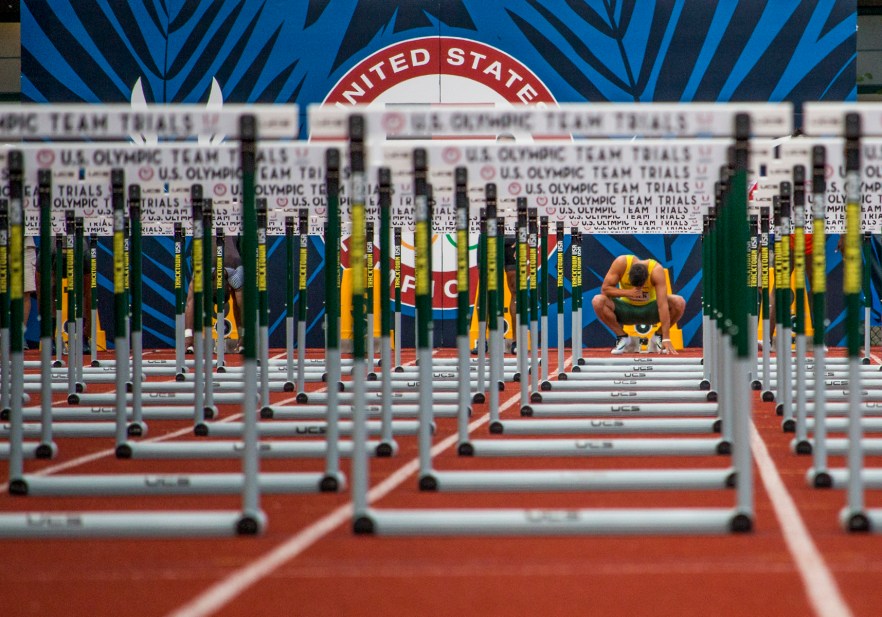 Oregon Duck Devon Allen completes the sign of the cross as he prepares for the finals in the men's 110 meter hurdles. Allen placed first in 13.03 and will head to Rio. Day Nine of the U.S. Olympic Trials Track and Field continued on Saturday at Hayward Field in Eugene, Ore. and will continue through July 10. Photo by Katie Pietzold