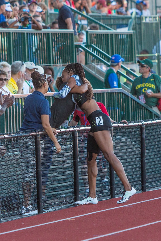 A member of the crowd embraces Sanya Richards-Ross as she makes her way around Hayward Field after stepping out of the women’s 400 meter dash. Richards-Ross had been struggling with an injury prior to the trials and was unable to complete the race. Day One of the U.S. Olympic Trials Track and Field began on Friday at Hayward Field in Eugene, Ore. and will continue through July 10. Photo by Katie Pietzold