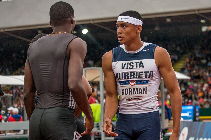 High schooler Michael Norman receives a high five from Adidas Curtis Mitchell after completing the prelims of the men’s 200 meter dash in 20.06 and taking first in their heat. Day Seven of the U.S. Olympic Trials Track and Field were held Thursday at Hayward Field in Eugene, Ore. and will continue through July 10. Photo by Katie Pietzold