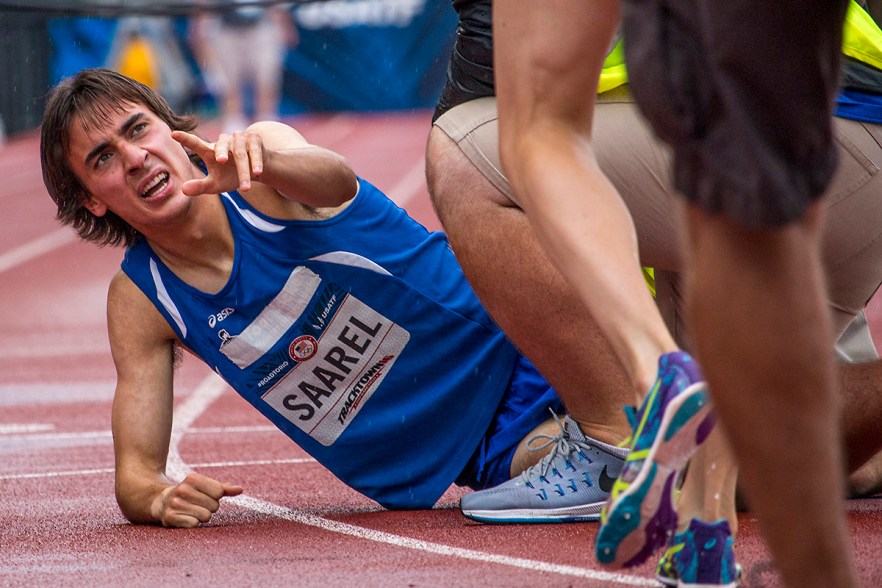 Colorado’s Ben Saarel reaches for assistance after collapsing to the ground as he finished running in the prelims of the men’s 1,500 meter run. Day Seven of the U.S. Olympic Trials Track and Field were held Thursday at Hayward Field in Eugene, Ore. and will continue through July 10. Photo by Katie Pietzold