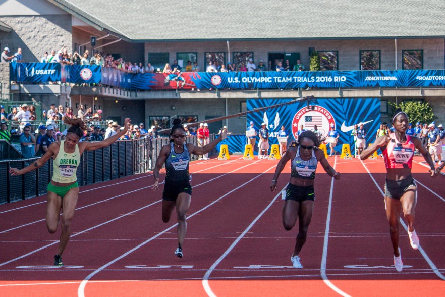 Oregon Duck Deajah Stevens, Nike’s Tawanna Meadows, Texas Longhorn Morolake Akinosun, and Adidas’ Tori Bowie all lean into the finish of the women’s 100 meter semi-finals. Day Three of the U.S. Olympic Trials Track and Field were held Sunday at Hayward Field in Eugene, Ore. and will continue through July 10. Photo by Katie Pietzold