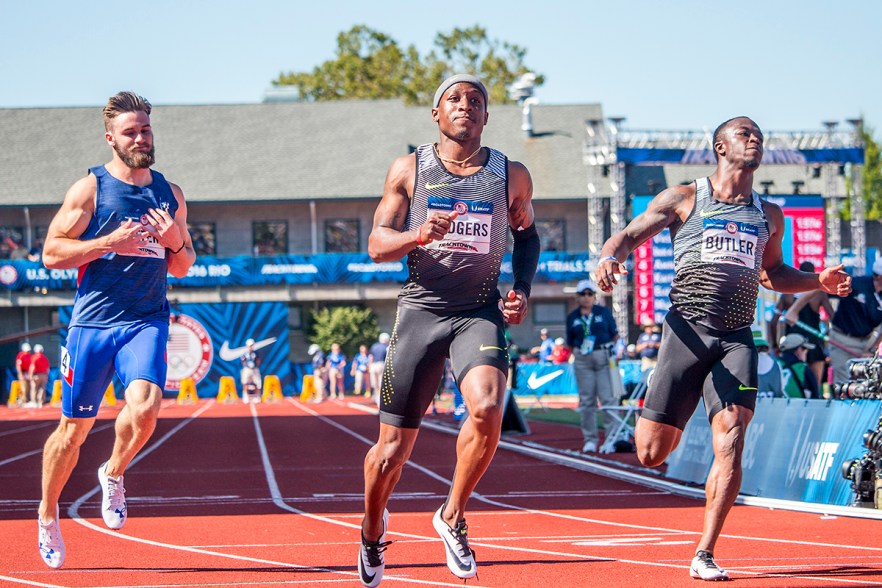 John Teeters, Nike’s Michael Rodgers, and Nike’s Quentin Butler sprint through the finish of the semi-finals in the men’s 100 meter dash. Day Three of the U.S. Olympic Trials Track and Field were held Sunday at Hayward Field in Eugene, Ore. and will continue through July 10. Photo by Katie Pietzold