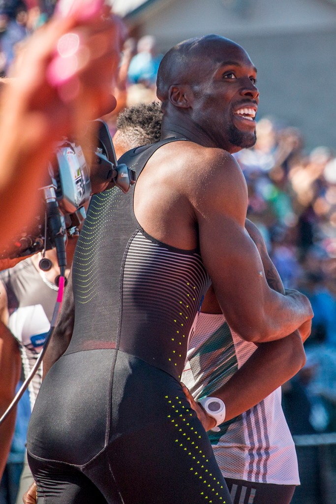Nike’s LaShawn Merritt celebrates with a competitor as he sees his qualifying time for Rio on the display board. Merritt placed first in 43.97. Day Three of the U.S. Olympic Trials Track and Field were held Sunday at Hayward Field in Eugene, Ore. and will continue through July 10. Photo by Katie Pietzold