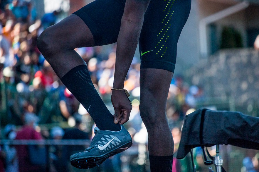 Nike’s Marquis Dendy evaluates his ankle after running on it wrong during an attempt in the men’s long jump finals. Day Three of the U.S. Olympic Trials Track and Field were held Sunday at Hayward Field in Eugene, Ore. and will continue through July 10. Photo by Katie Pietzold
