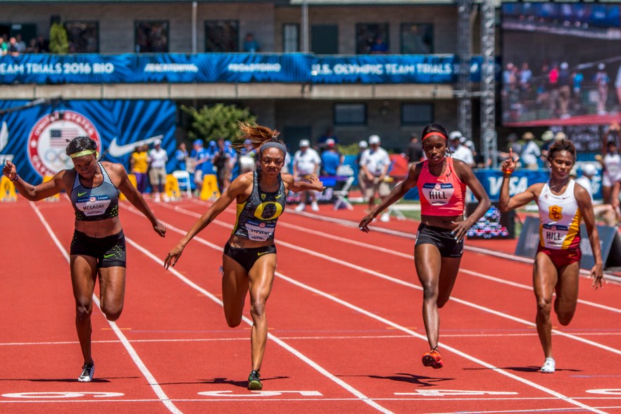 Nike’s Candace McGrone, Oregon Duck Deajah Stevens, Asics’ Candace Hill, and USC Trojan Deanna Hill race to the finish line of the women’s 100 meter dash in the second heat. Day Two of the U.S. Olympic Trials Track and Field were held Saturday at Hayward Field in Eugene, Ore. and will continue through July 10. Photo by Katie Pietzold